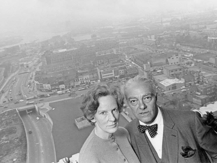 Goldfinger and his wife, Ursula, on the balcony of their 24th floor flat in Balfron Tower. As Balfron Tower's architect, he lived in the building to discover the advantages and disadvantages of life in a high-rise property (Image: Hulton Archive/Getty Images)